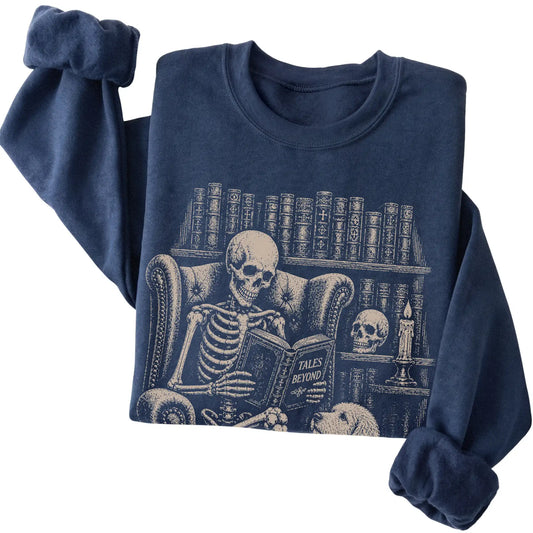 Folded Navy sweatshirt with a skeleton reading Tales Beyond to a Labradoodle