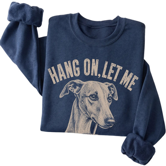 Navy crewneck sweatshirt featuring Overthinking Whippet, folded presentation