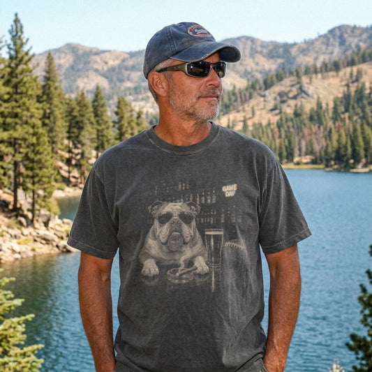 Model wearing a Pepper Comfort Colors® T-shirt featuring Bulldog with beer and football graphics