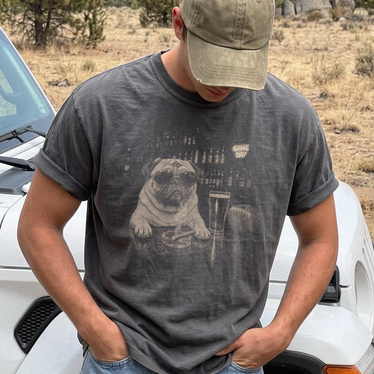 Model wearing a Pepper Comfort Colors® T-shirt featuring Pug with beer and football graphics