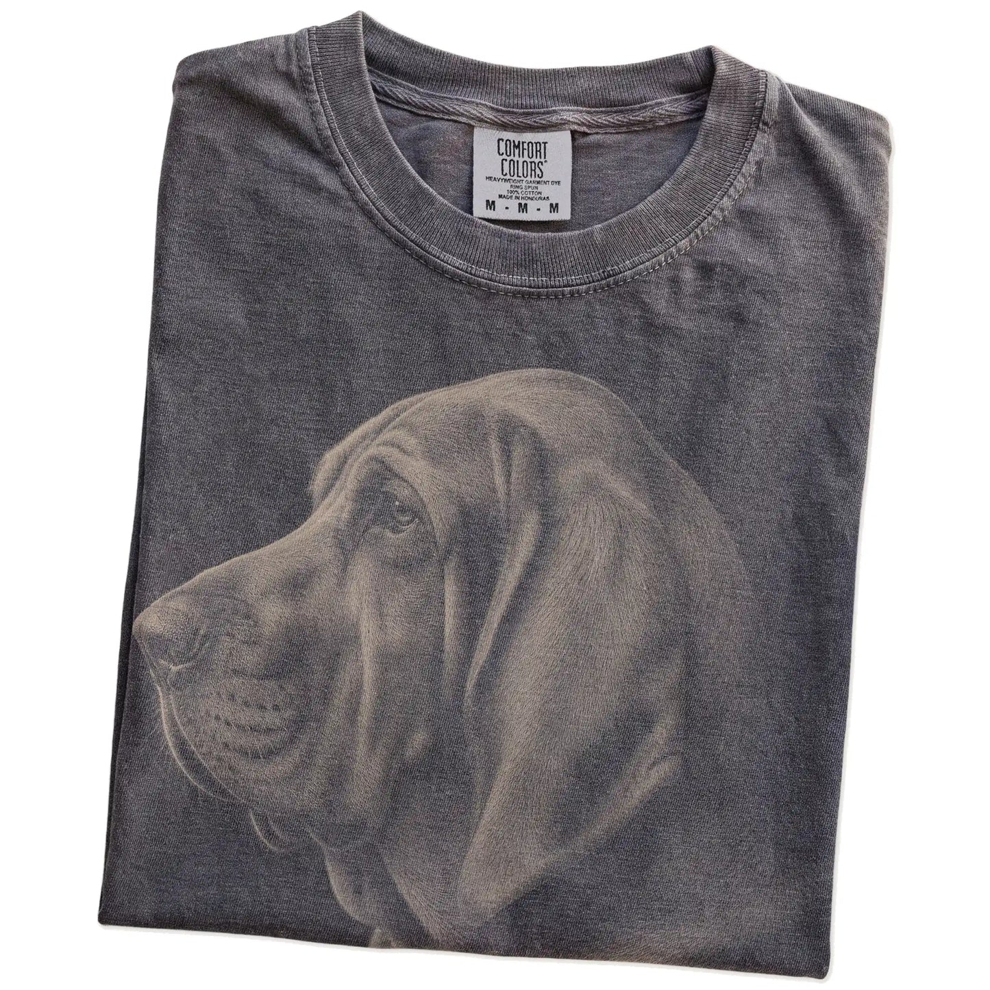 Folded Pepper Comfort Colors® T-shirt showing a detailed photographic portrait of a Bloodhound