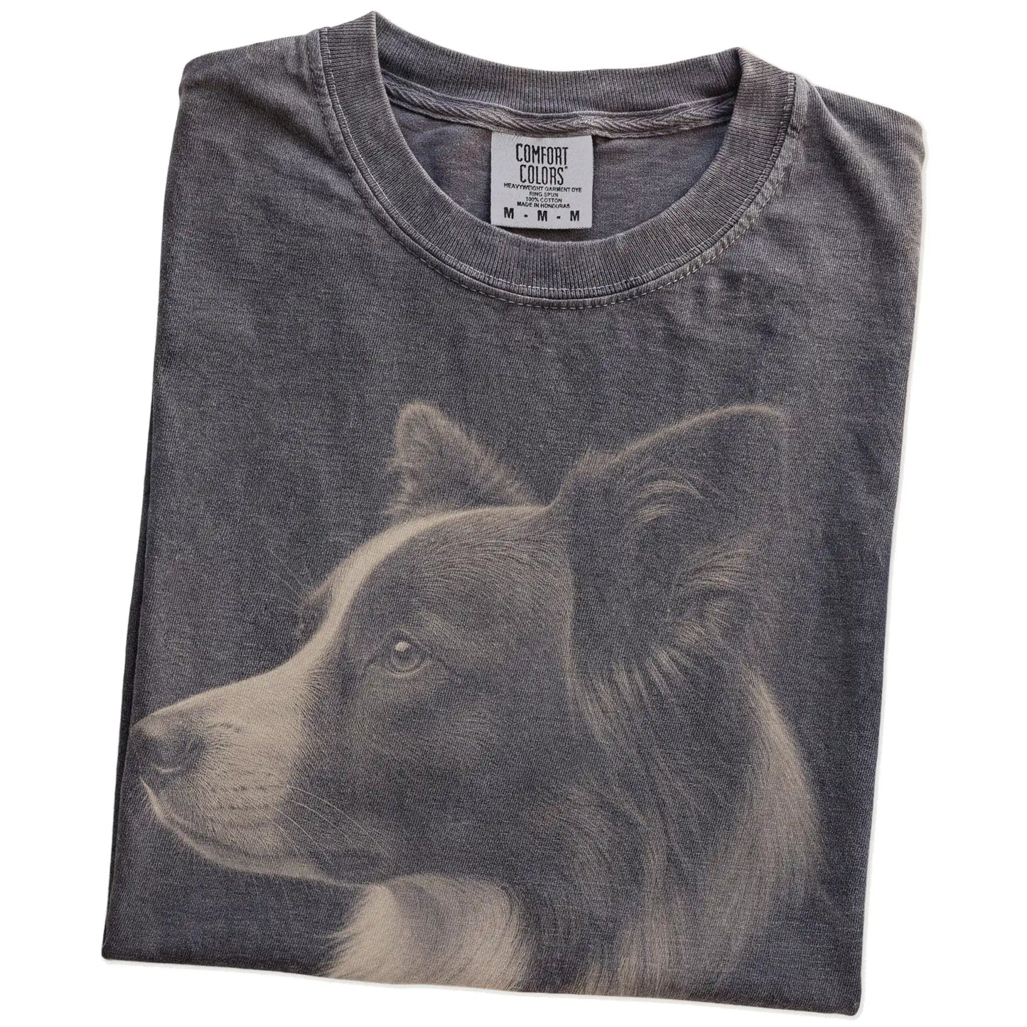 Folded Pepper Comfort Colors® T-shirt showing a detailed photographic portrait of a Border Collie