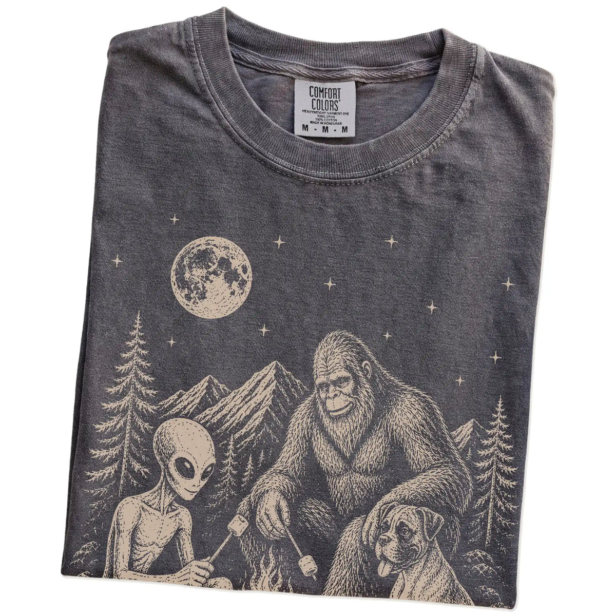 Folded Pepper Comfort Colors® T-shirt showing Boxer camping with Bigfoot and an alien