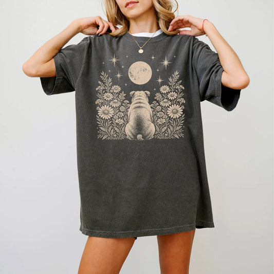 Model wearing a Pepper Comfort Colors® T-shirt featuring Bulldog beneath a wildflower moon