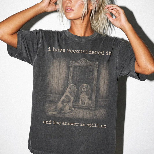 Model wearing a Pepper Comfort Colors® T-shirt with “the answer is still no” cavalier king charles spaniel design