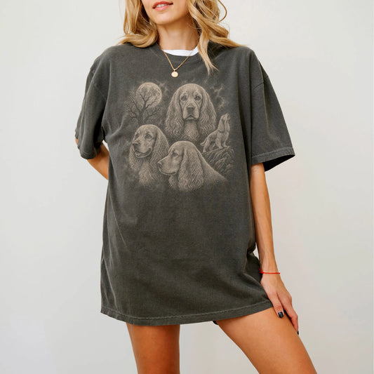 Model wearing a Pepper Comfort Colors® T-shirt with a vintage moon montage featuring Cocker Spaniel