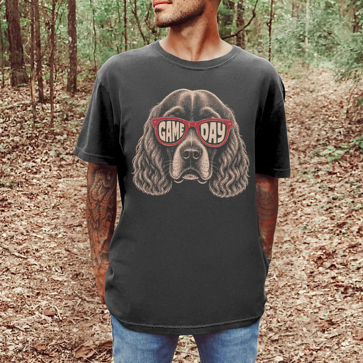Model wearing a Pepper Comfort Colors® T-shirt with cocker spaniel wearing red game day sunglasses