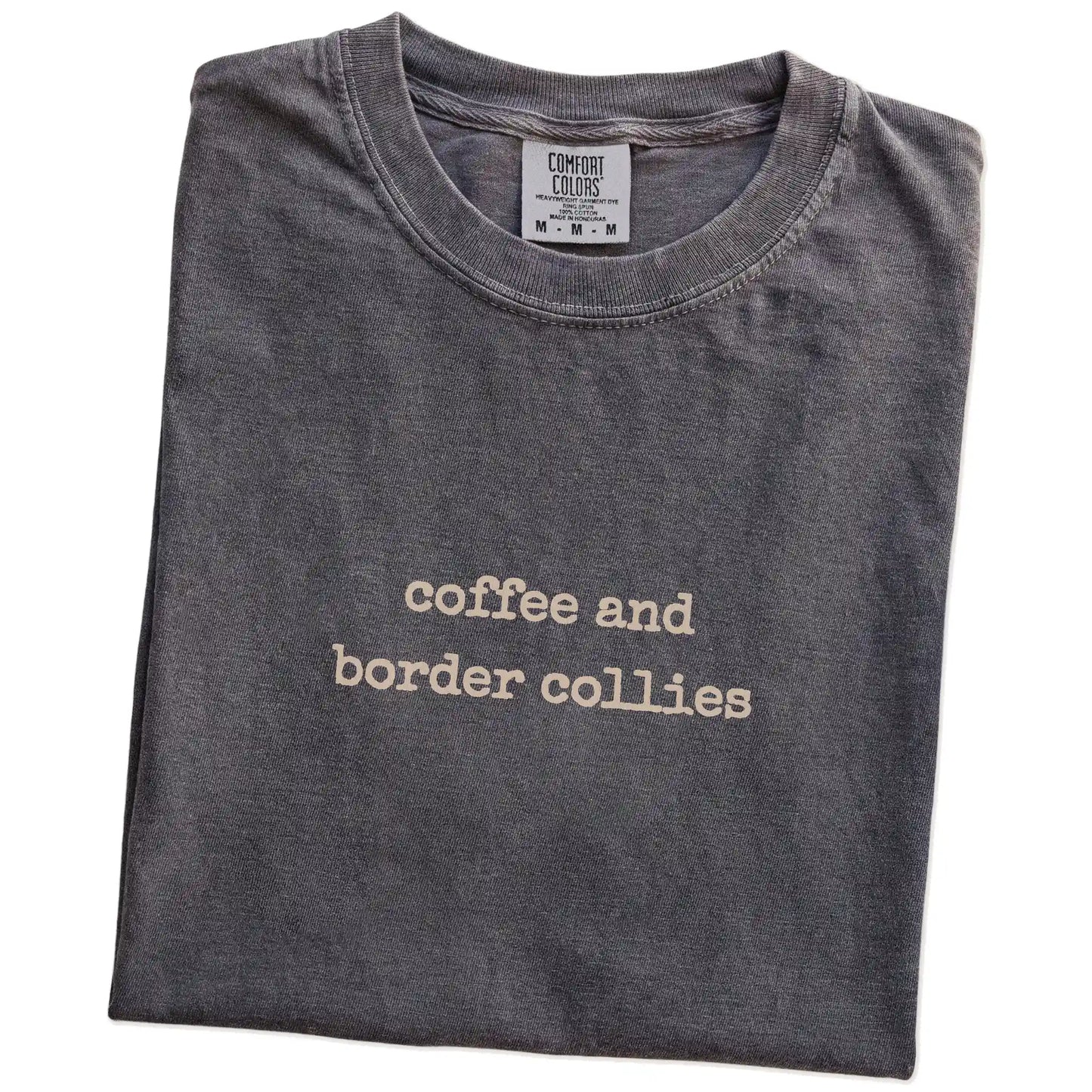 Folded Pepper Comfort Colors® T-shirt showing “coffee and border collies” retro text
