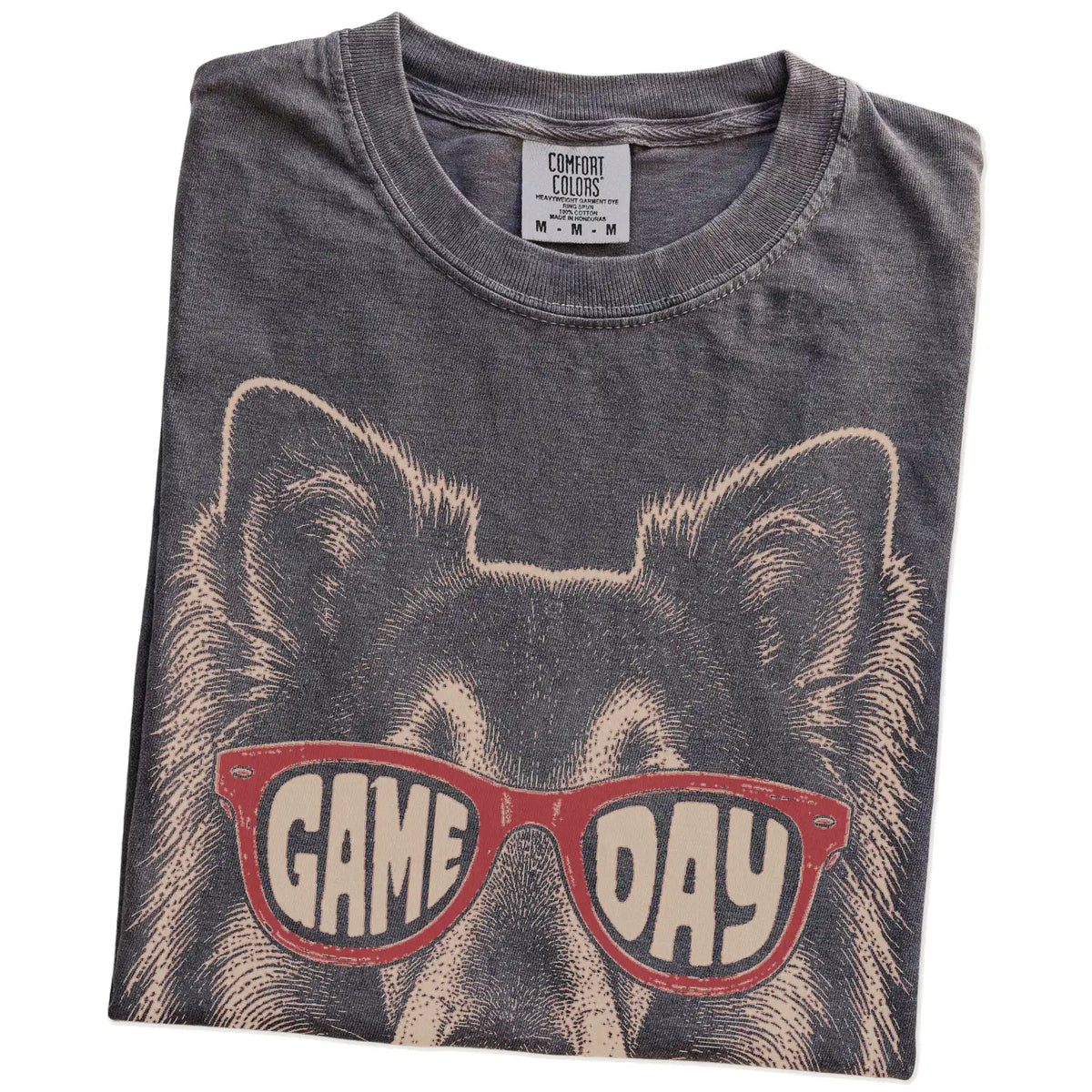 Folded Pepper Comfort Colors® T-shirt showing collie wearing red game day sunglasses