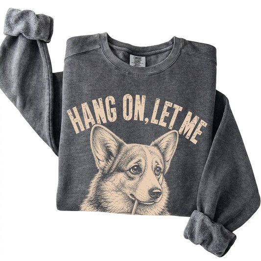 Pepper Comfort Colors sweatshirt featuring Corgi Iced Coffee Overthink, folded presentation