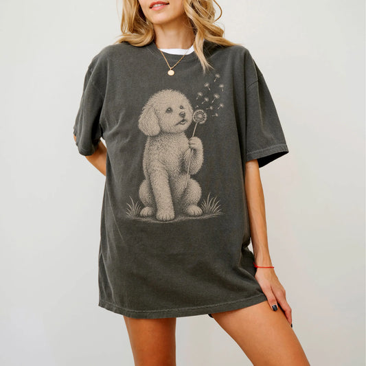 Model wearing a Pepper Comfort Colors® T-shirt showing Bichon Frise portrait with drifting dandelion seeds