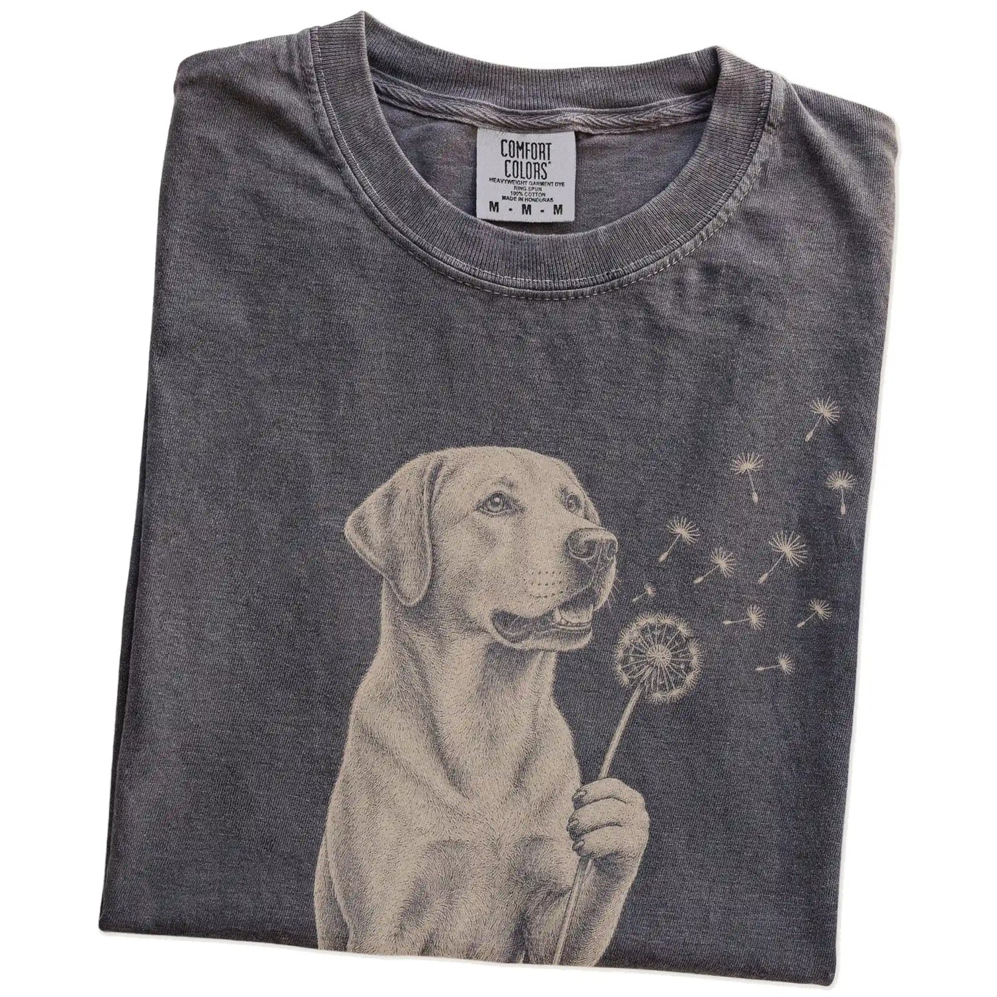 Folded Pepper Comfort Colors® T-shirt showing Labrador Retriever portrait with drifting dandelion seeds