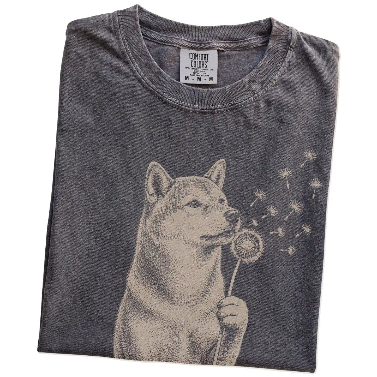 Folded Pepper Comfort Colors® T-shirt showing Shiba Inu portrait with drifting dandelion seeds