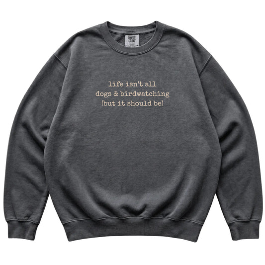 Pepper Dogs and Birdwatching Comfort Colors sweatshirt laid flat