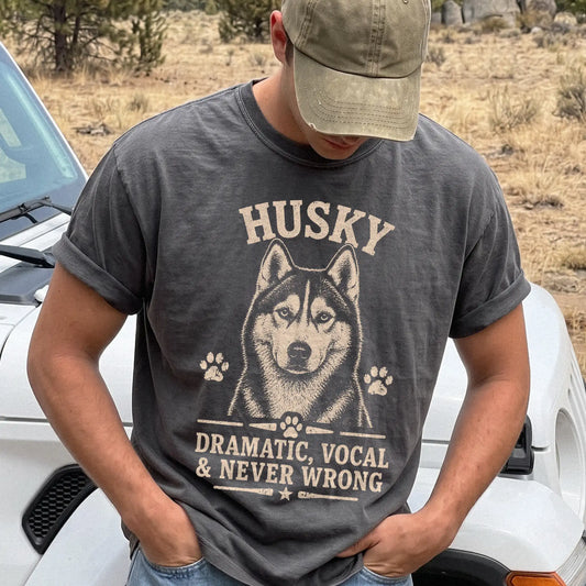 Model wearing a Pepper Comfort Colors® T-shirt featuring Husky design with “Dramatic, Vocal & Never Wrong” lettering