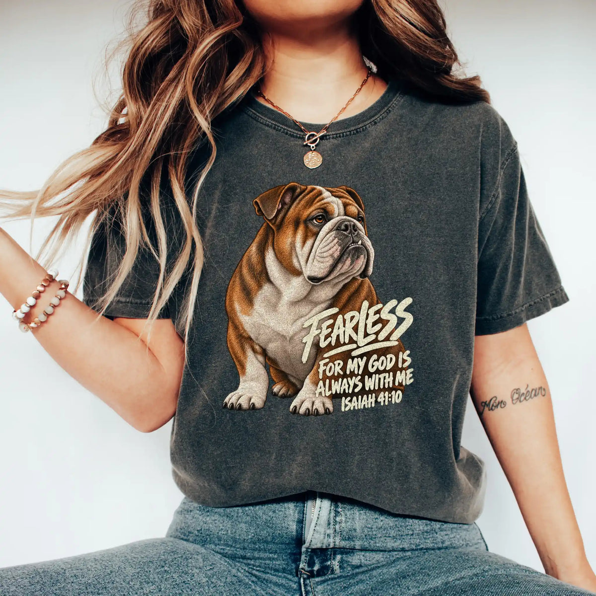 Woman wearing a pepper Fearless Bulldog T-shirt with Isaiah 41:10