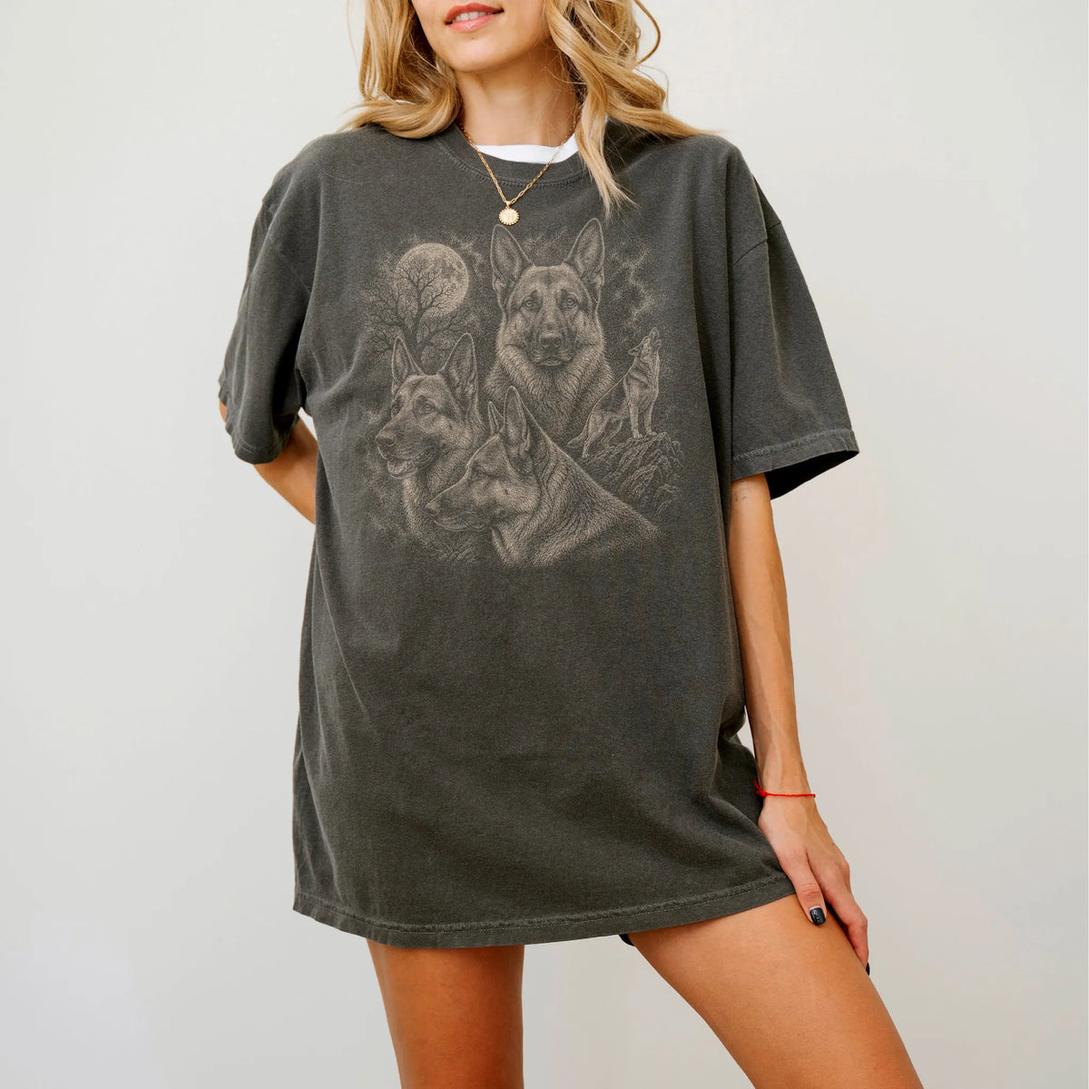 Model wearing a Pepper Comfort Colors® T-shirt with a vintage moon montage featuring German Shepherd