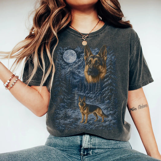 Model wearing a pepper T-shirt with German Shepherd Winter Moon artwork.