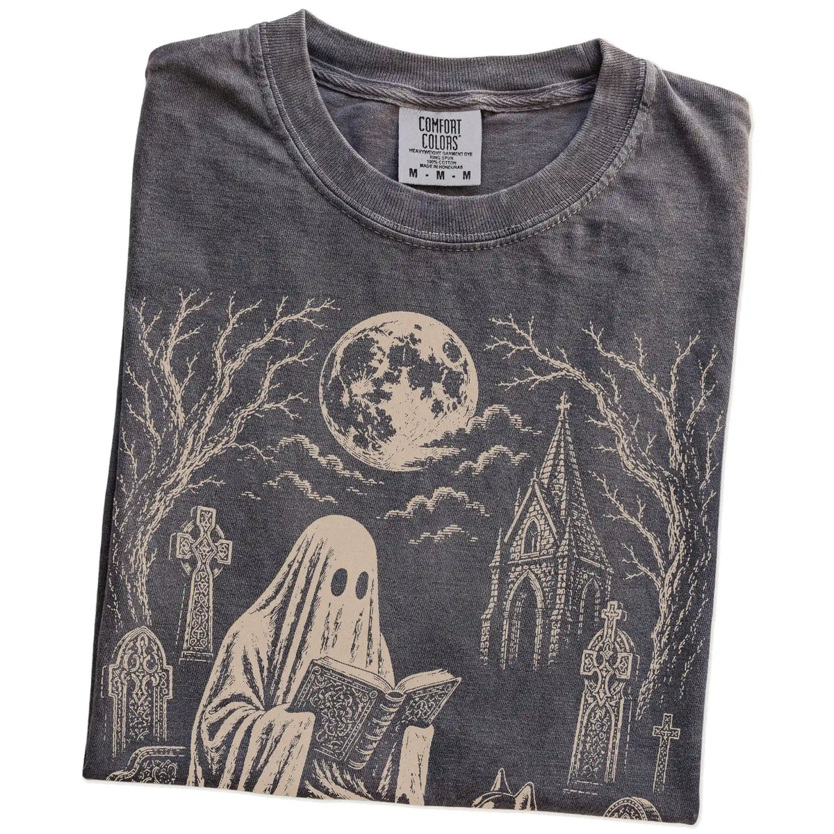 Folded Pepper Comfort Colors® T-shirt showing Husky beside a reading ghost in a moonlit graveyard
