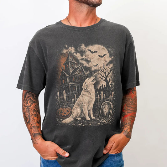 Model wearing a Pepper Comfort Colors® T-shirt showing Golden Retriever in a vintage haunted-house scene