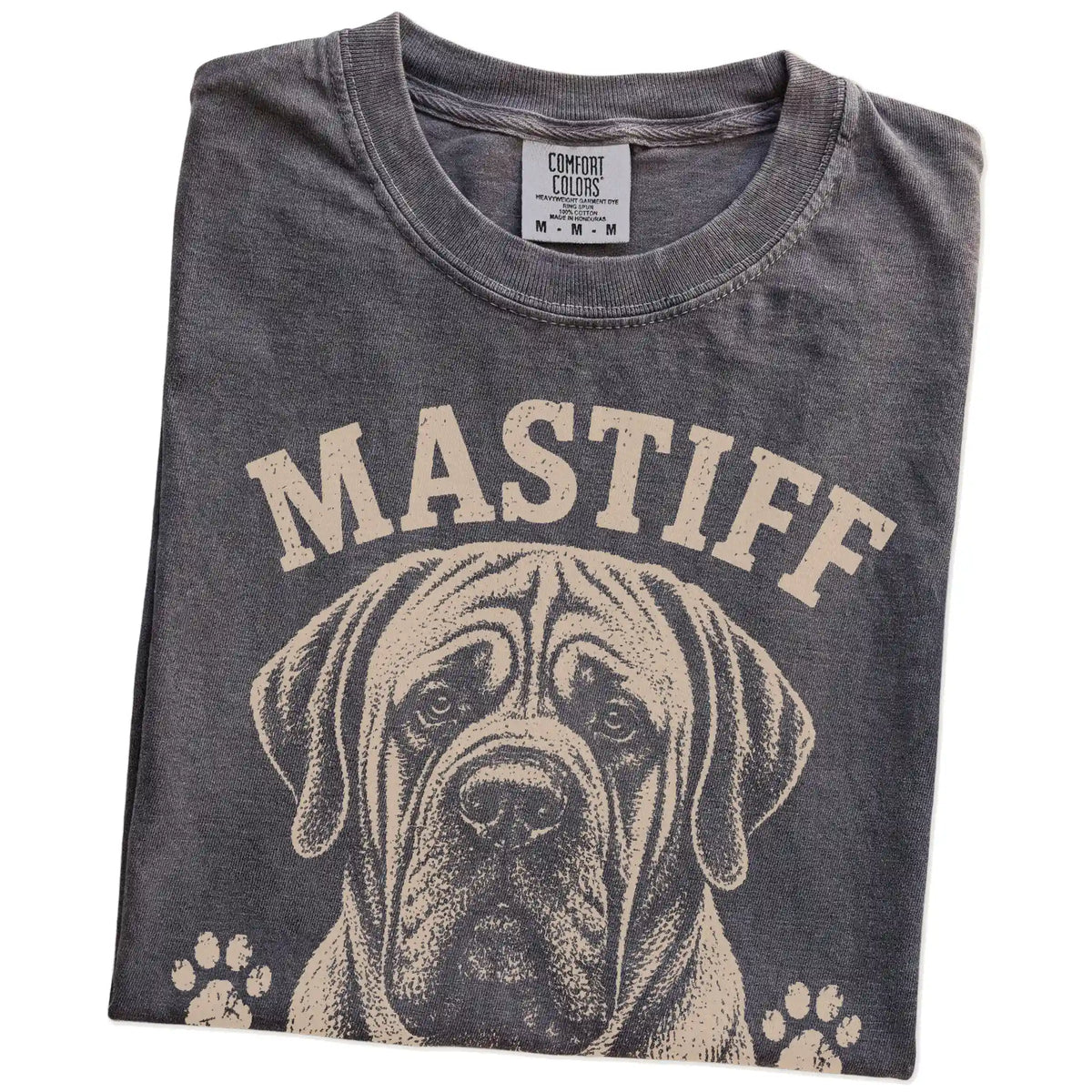 Folded Pepper Comfort Colors® T-shirt showing Mastiff design with “Heavyweight Champion Of Chill” lettering