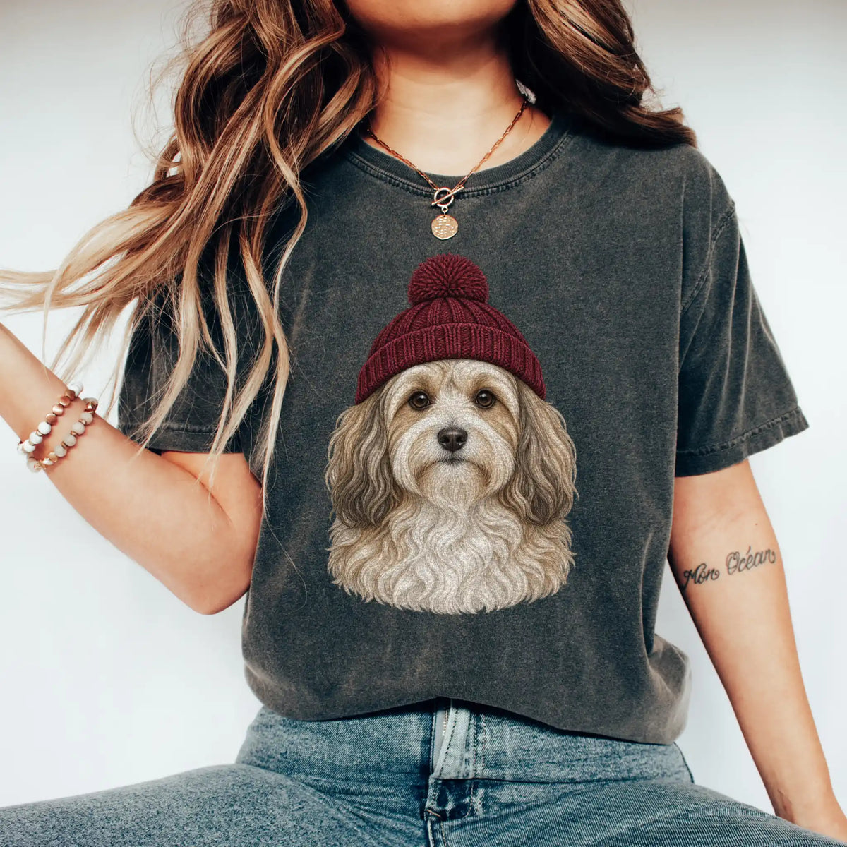 Woman wearing a Pepper Havanese hipster T-shirt with a maroon-beanie dog portrait