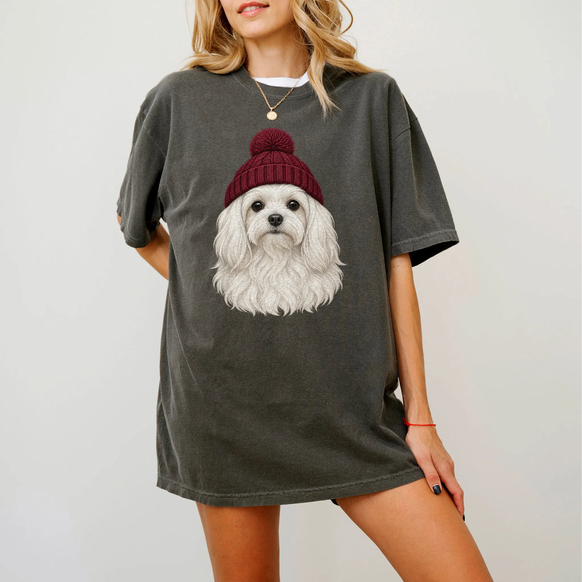Woman wearing a Pepper Maltese hipster T-shirt with a maroon-beanie dog portrait