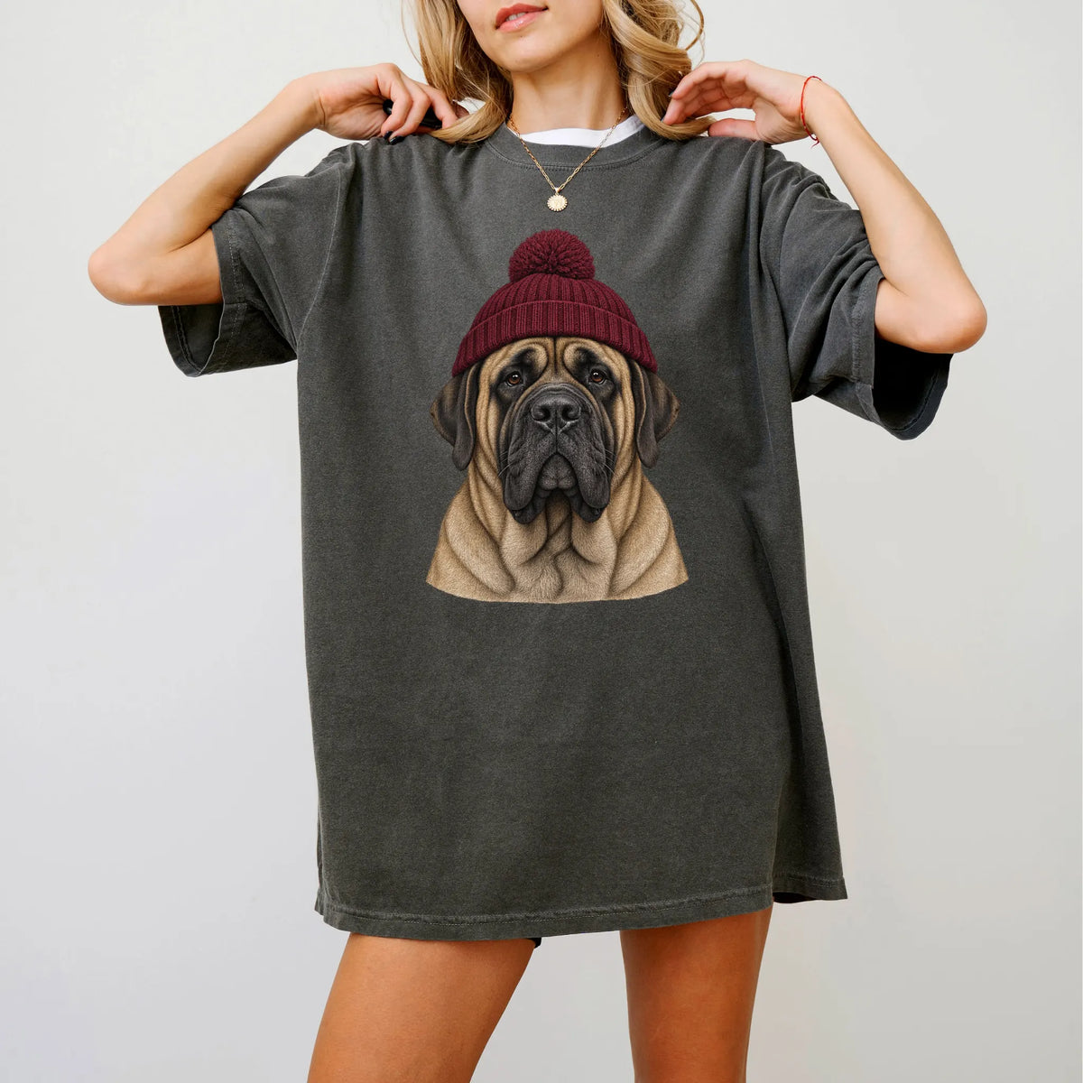 Woman wearing a Pepper Mastiff hipster T-shirt with a maroon-beanie dog portrait
