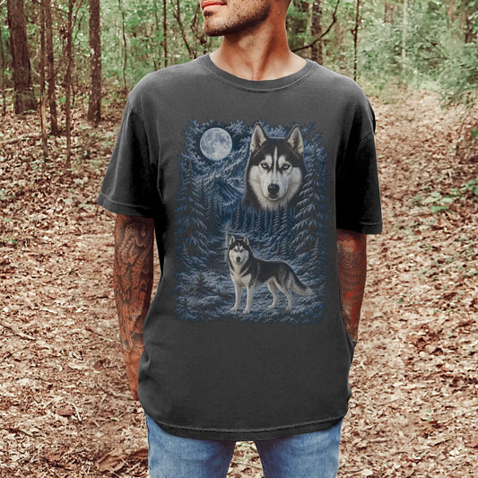 Model wearing a pepper T-shirt with Husky Winter Moon artwork.
