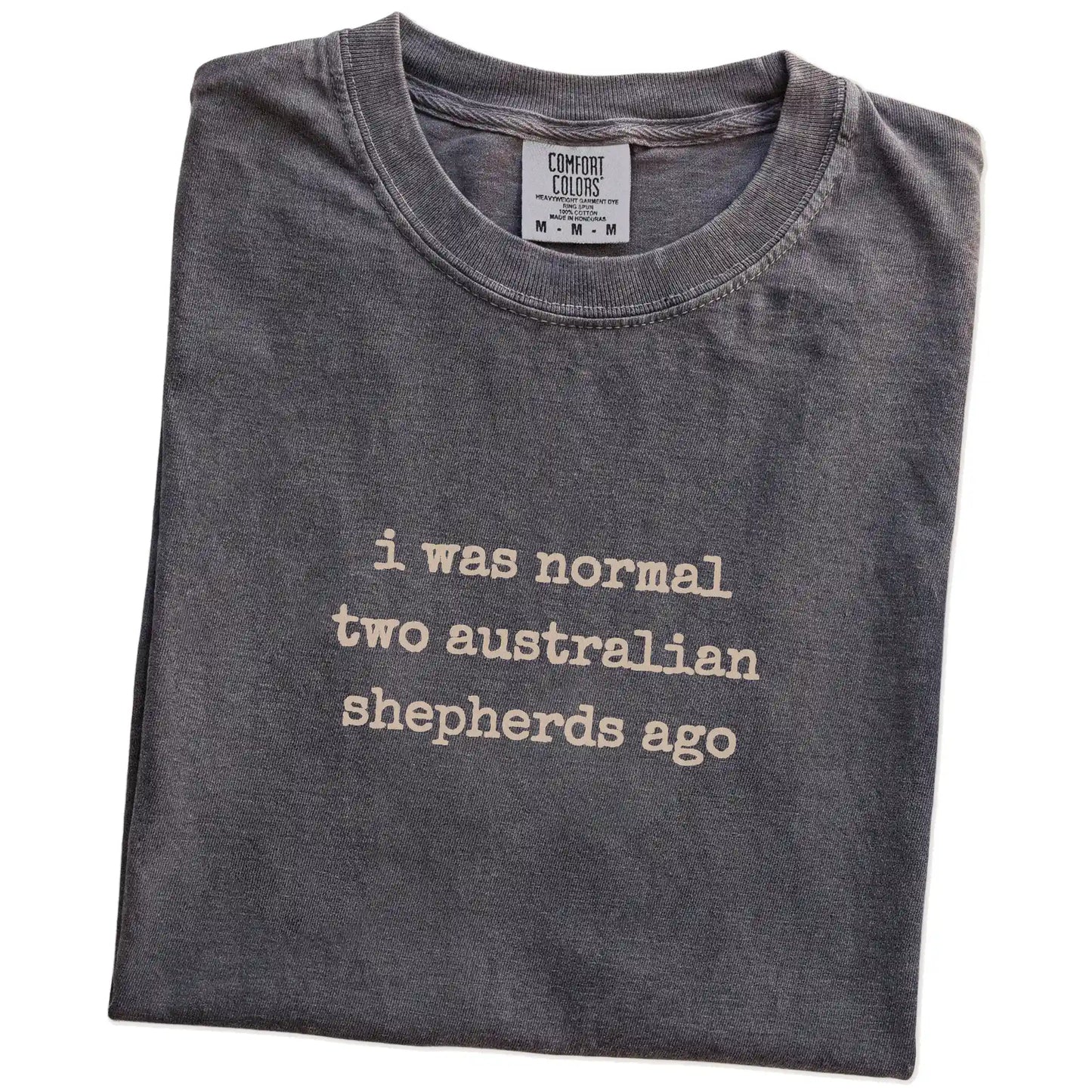 Folded Pepper Comfort Colors® T-shirt showing i was normal two australian shepherds ago lettering