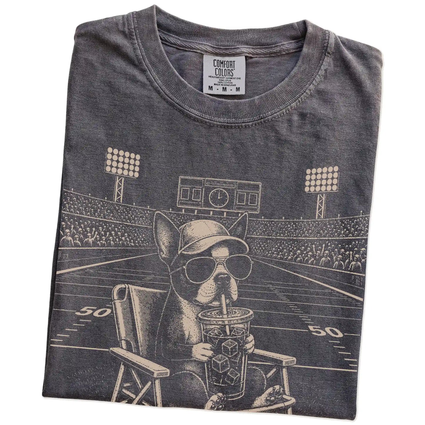 Folded Pepper Comfort Colors® T-shirt showing Boston Terrier claiming the football field with “I Live Here Now” lettering