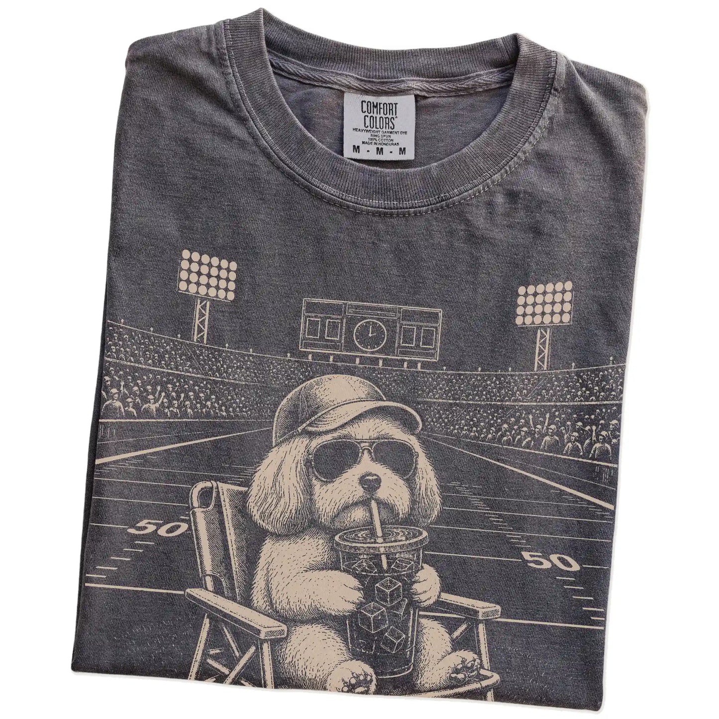 Folded Pepper Comfort Colors® T-shirt showing Havanese claiming the football field with “I Live Here Now” lettering