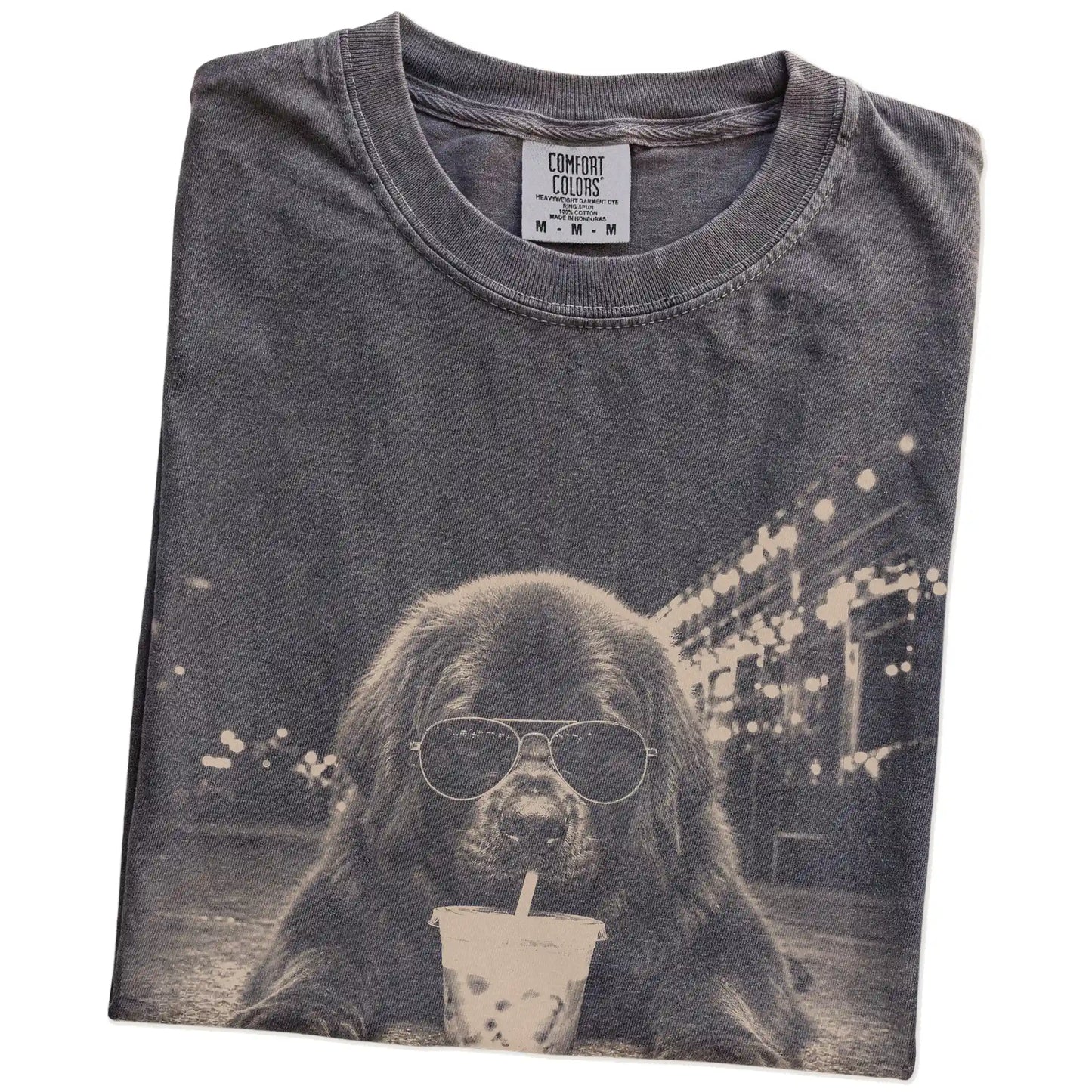 Folded Pepper Comfort Colors® T-shirt showing Newfie with iced coffee in a retro grunge design