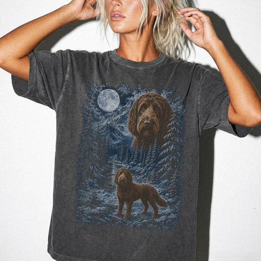 Model wearing a pepper T-shirt with Labradoodle Winter Moon artwork.