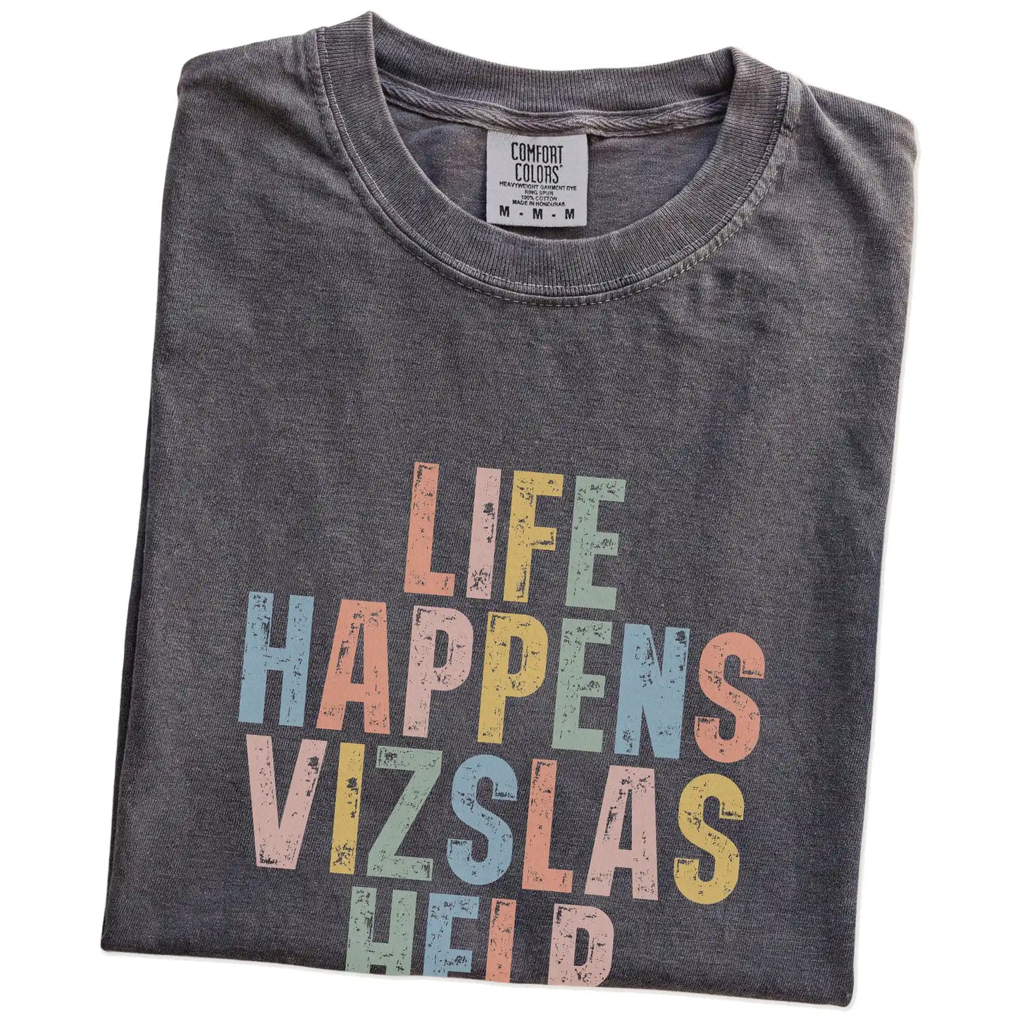 Folded Pepper Comfort Colors® T-shirt showing retro “Life Happens, Vizslas Help” lettering