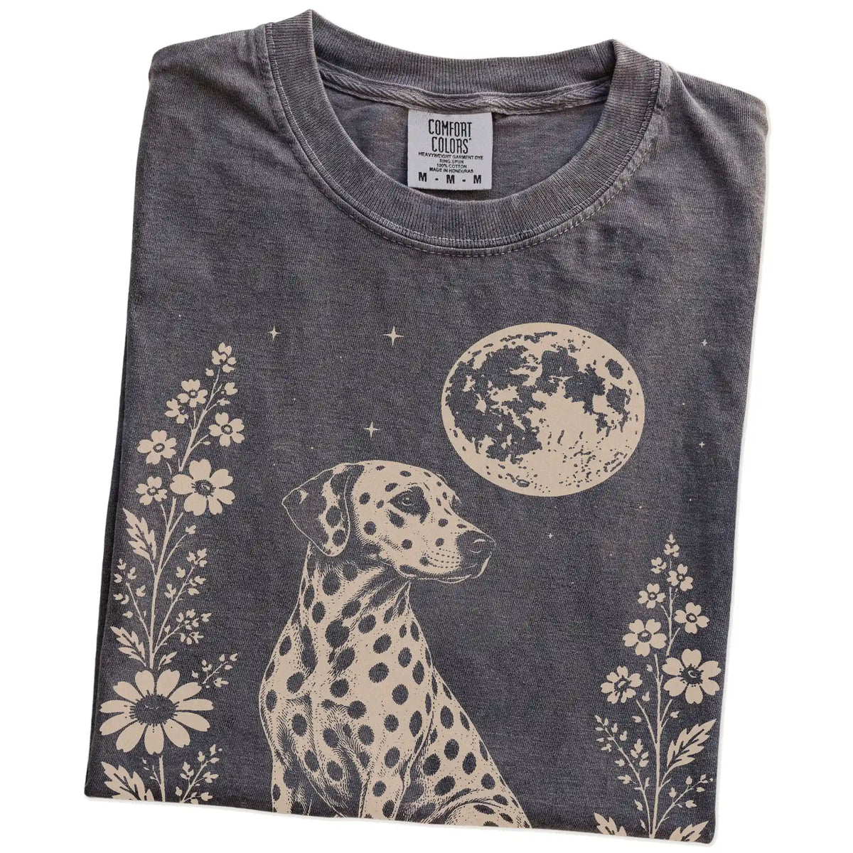 Folded Pepper Comfort Colors® T-shirt showing Dalmatian framed by flowers beneath the moon
