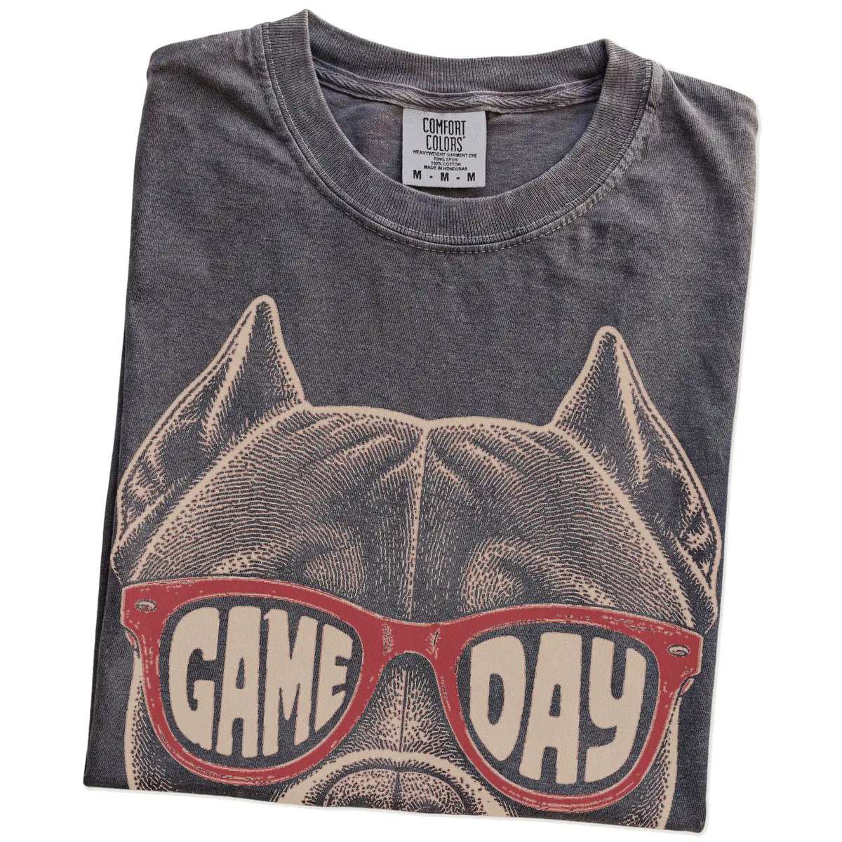 Folded Pepper Comfort Colors® T-shirt showing pitbull wearing red game day sunglasses