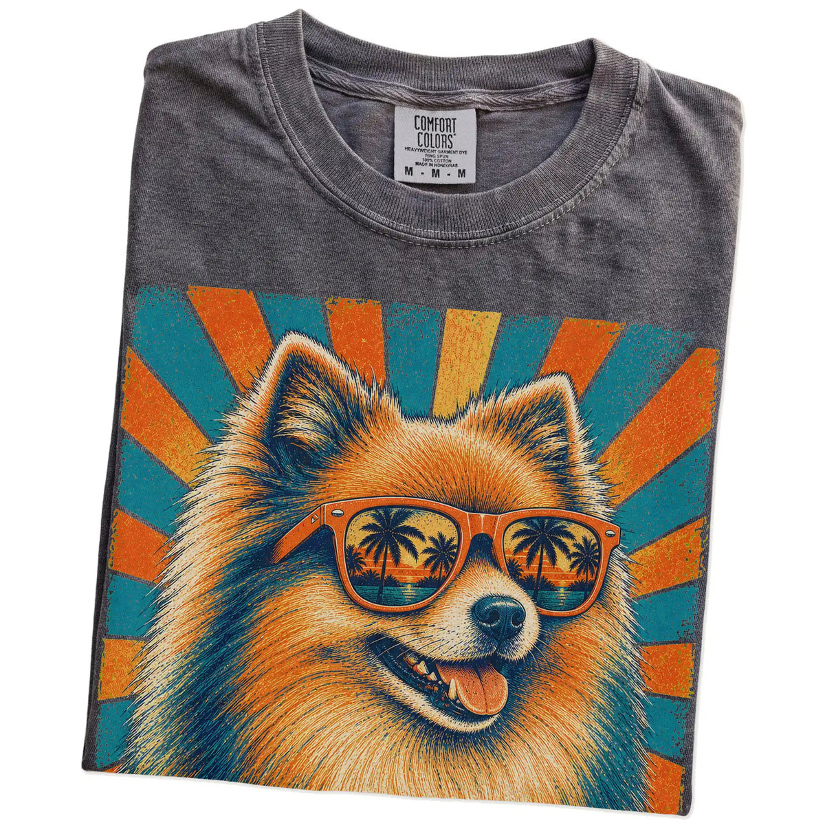 Retro Pomeranian Dad design on a Pepper Comfort Colors T-shirt folded detail