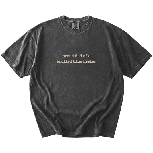 Proud Dad of a Spoiled Blue Heeler lettering on a Pepper Comfort Colors® T-shirt