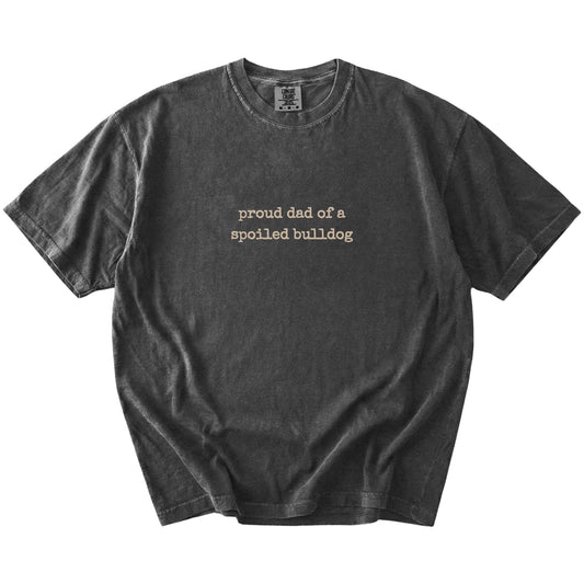 Proud Dad of a Spoiled Bulldog lettering on a Pepper Comfort Colors® T-shirt