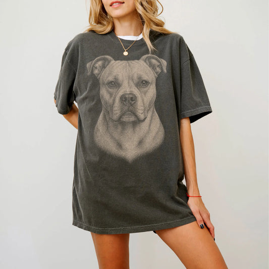 Model wearing a Pepper Comfort Colors® T-shirt with a realistic drawing of a American Bulldog