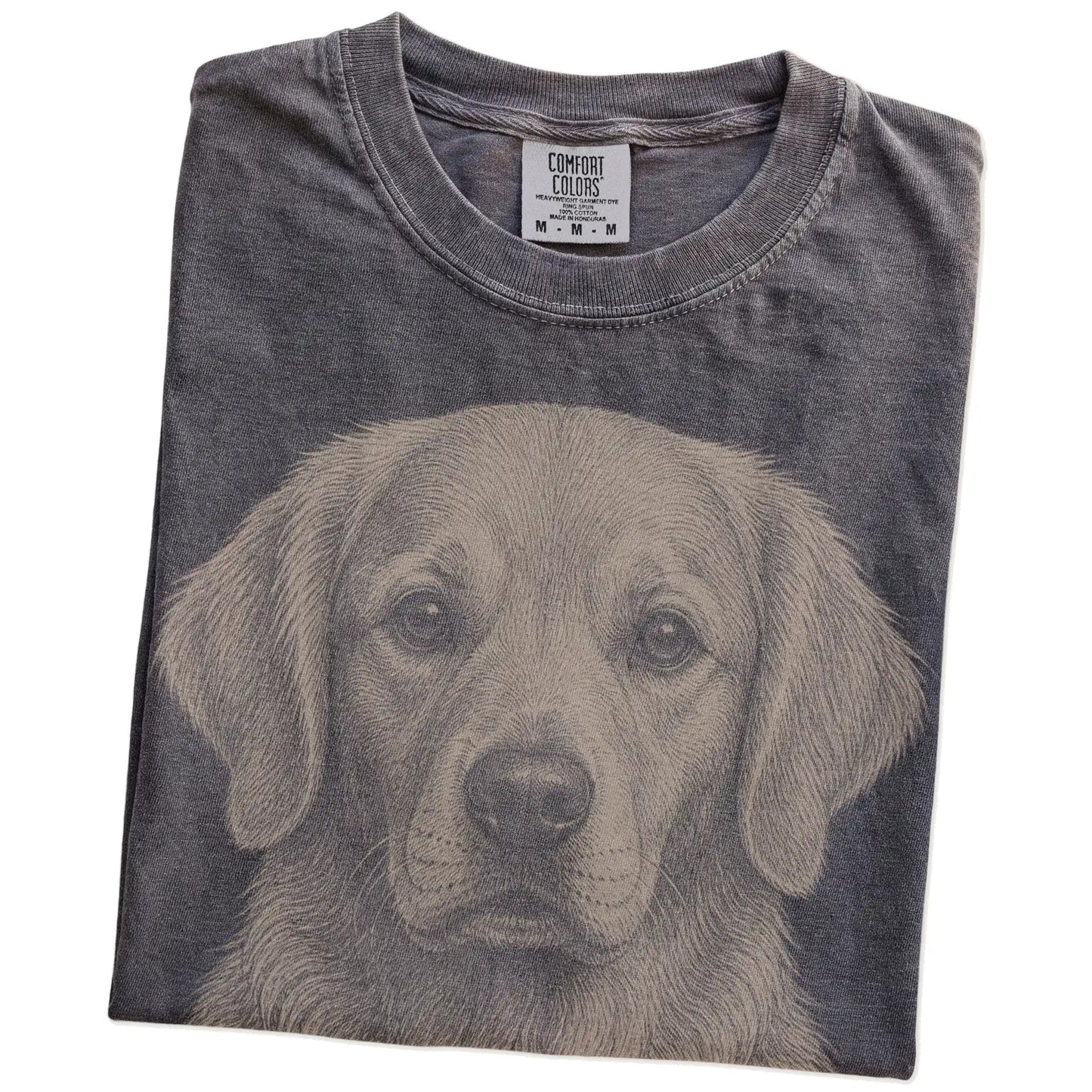Folded Pepper Comfort Colors® T-shirt showing a realistic drawing of a Golden Retriever