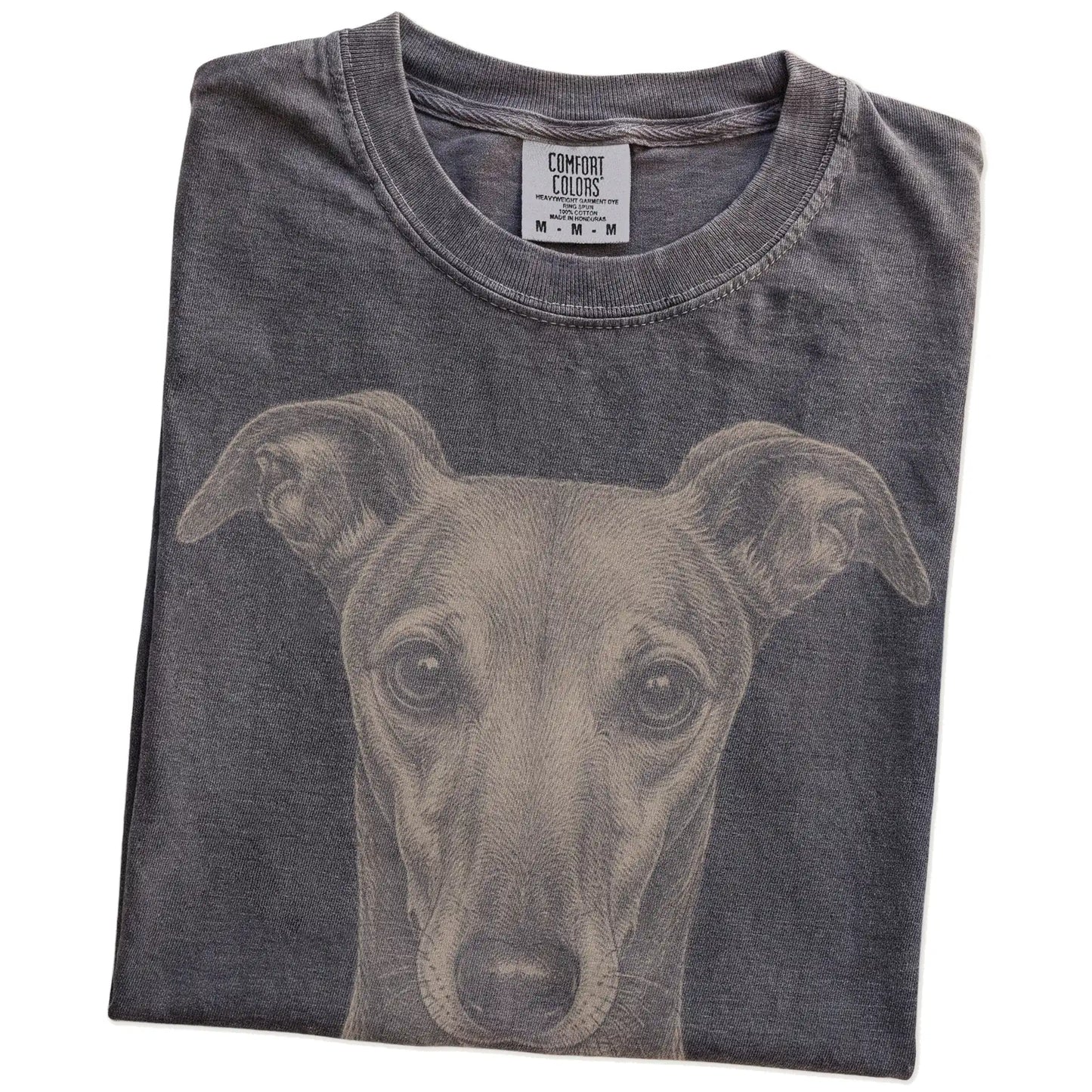 Folded Pepper Comfort Colors® T-shirt showing a realistic drawing of a Greyhound