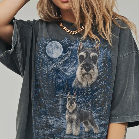 Model wearing a pepper T-shirt with Schnauzer Winter Moon artwork.
