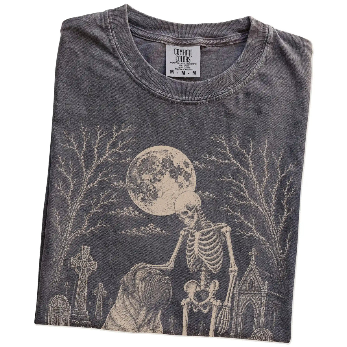 Folded Pepper Comfort Colors® T-shirt showing Mastiff sharing a quiet cemetery moment with a friendly skeleton