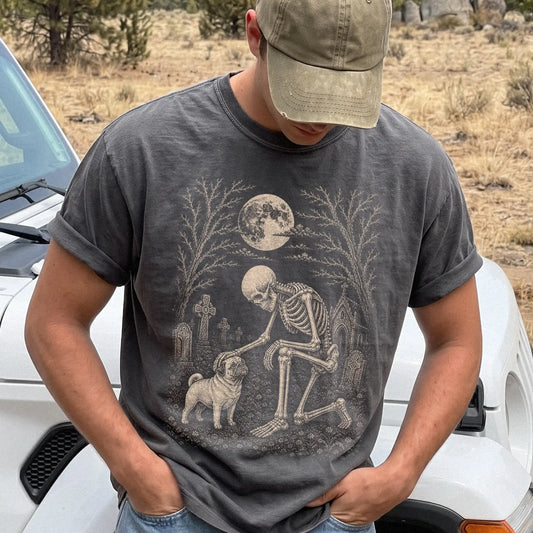 Model wearing a Pepper Comfort Colors® T-shirt showing Pug sharing a quiet cemetery moment with a friendly skeleton