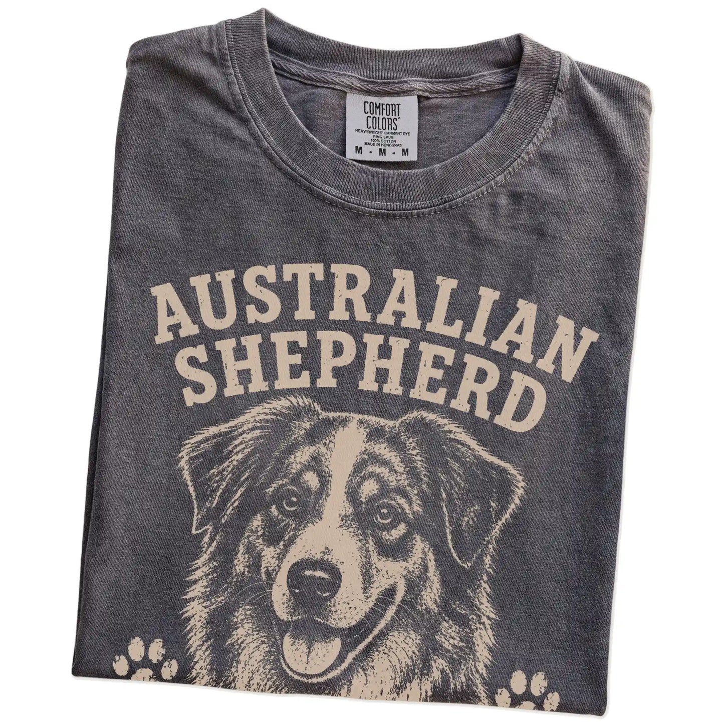 Folded Pepper Comfort Colors® T-shirt showing Australian Shepherd design with “Smart, Stubborn & A Little Extra” lettering