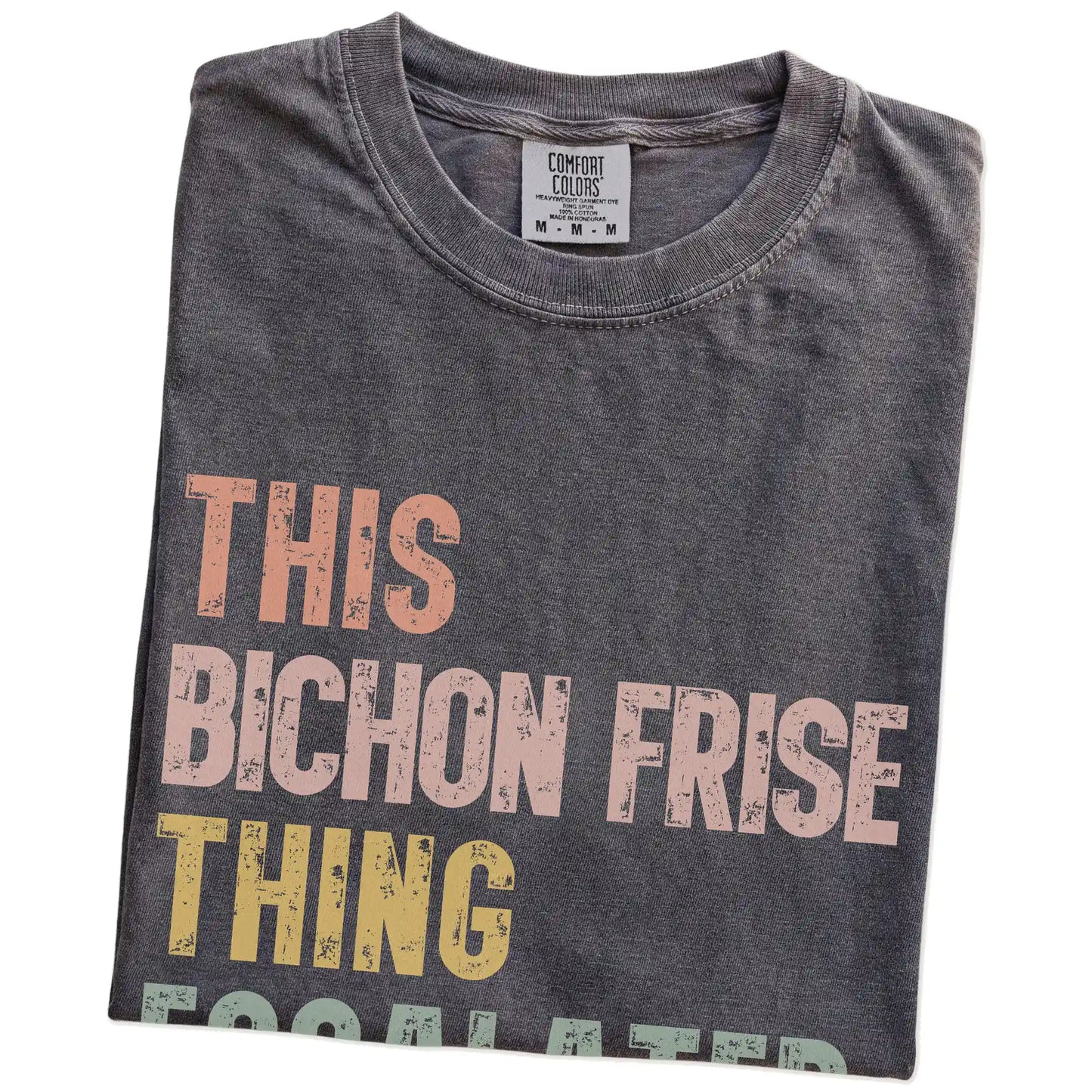 Folded Pepper Comfort Colors® T-shirt showing retro “This Bichon Frise Thing Escalated Quickly” lettering
