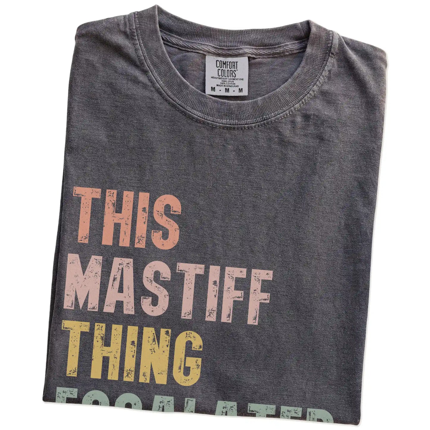 Folded Pepper Comfort Colors® T-shirt showing retro “This Mastiff Thing Escalated Quickly” lettering