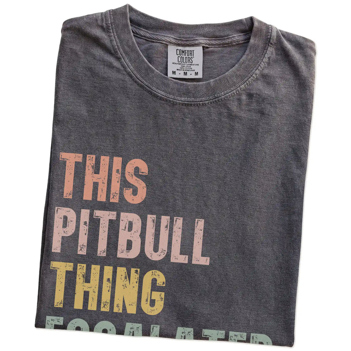 Folded Pepper Comfort Colors® T-shirt showing retro “This Pitbull Thing Escalated Quickly” lettering
